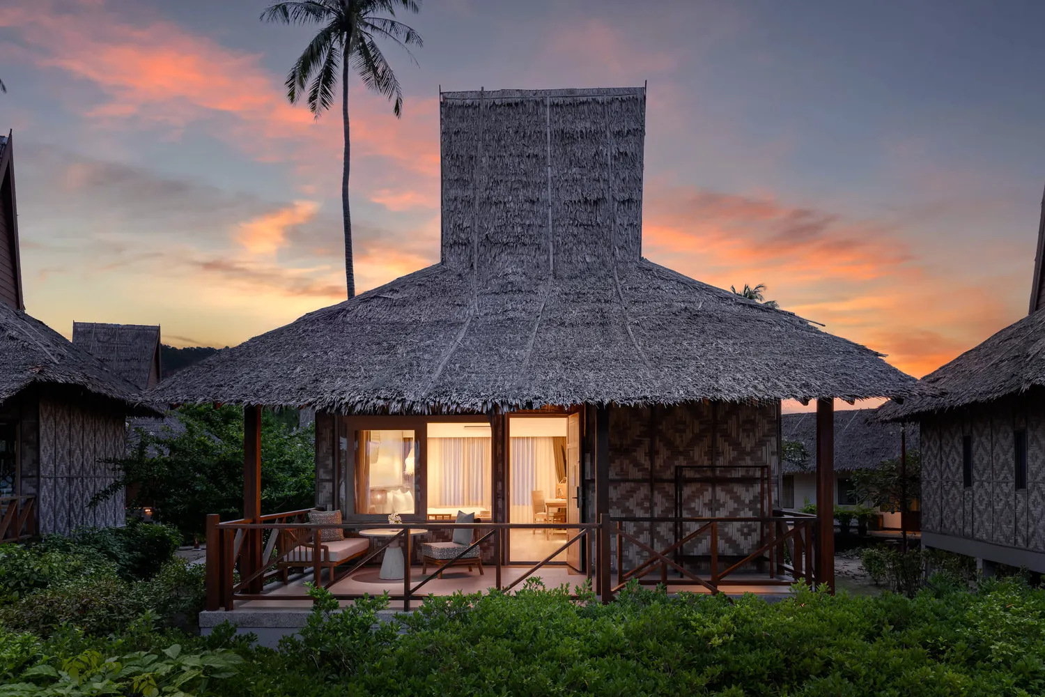 Beachfront bungalow at sunset